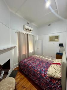 a bedroom with a bed in a room at 3BR Guest House near Adelaide CBD Joslin 5070 in Evandale