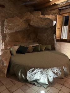 Кровать или кровати в номере Paolino848