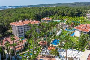an aerial view of a resort with a pool and trees at Utopia Resort & Residence in Avsallar