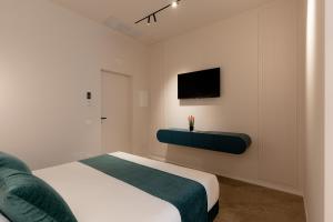 TV a/nebo společenská místnost v ubytování CA' DO' Guest House