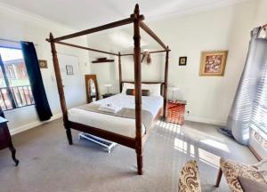 a bedroom with a four poster bed and a window at Beautiful Heritage Style Room in York in York