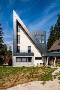 a house with a staircase on the side of it at Viva Vlasic - Apartman i vikendica in Šišava