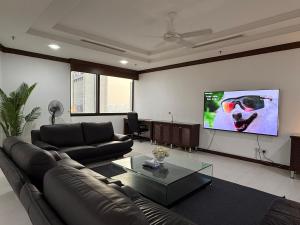 Et tv og/eller underholdning på Grand Service Apartment @ Times Square