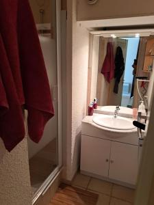 a bathroom with a sink and a mirror at Joli t2 valras plage in Valras-Plage