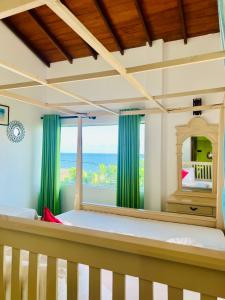 Ένα ή περισσότερα κρεβάτια σε δωμάτιο στο Harmony inn - Tangalle