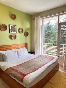 Кровать или кровати в номере Junglaat Stays & Experiences