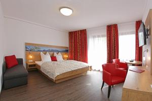 Postel nebo postele na pokoji v ubytování Hotel Seiserhof & Seiseralm