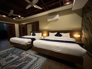 Кровать или кровати в номере Huamin Well Hotel E-7 +49 фотографий