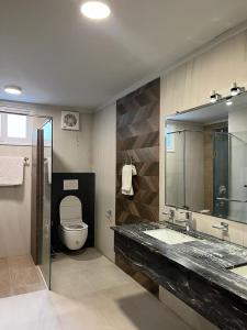 Ванная комната в Huamin Well Hotel E-7