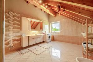 a bathroom with a sink and a washing machine at Haus Emanuel in Weilerbach +16 photos
