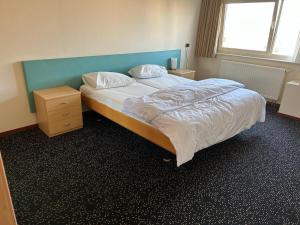 Postel nebo postele na pokoji v ubytování Fokkeboom