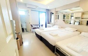 Ένα ή περισσότερα κρεβάτια σε δωμάτιο στο B-your home Hotel Don Mueang Airport Bangkok 如你家酒店