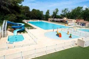 a large pool with a slide and a water park at Appartement 3 chambres - 8 couchages in Six-Fours-les-Plages