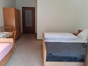Postel nebo postele na pokoji v ubytování Pension Karner + 10 fotografií