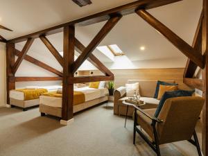 a bedroom with two beds and a couch at Pałac w Małkowie in Warta +81 photos