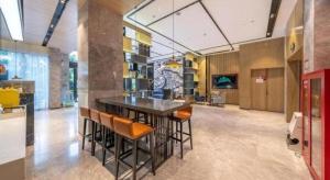 Телевизор и/или развлекательный центр в Echarm Hotel Taizhou International Convention and Exhibition Center