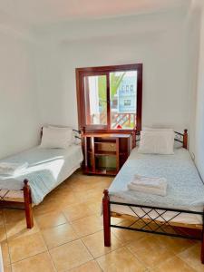 Postel nebo postele na pokoji v ubytování Mi Casa Jardins de Cabo Negro