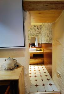 a kitchen with a table and a pot on a counter at Siguniang Mountain Lanxi Wild Luxury Hotel in Mount Siguniang +165 photos