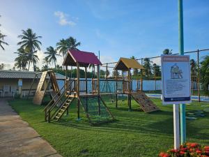 a park with a playground with a slide at Casa Harmonia in Aracaju
