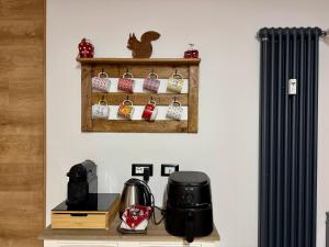 a shelf with knick knacks on a wall at Bardo Chalet in Bardonecchia