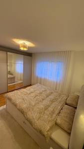 Кровать или кровати в номере Ferienwohnung RheinZeit