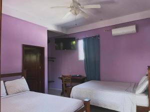 Giường trong phòng chung tại Lokoo Resort