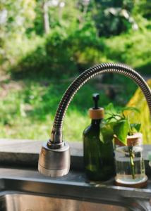a kitchen sink with a faucet and a bottle of soap at Casa De Amor Lambug in Badian +64 photos