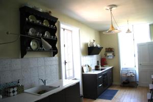 a kitchen with a sink and a counter and a window at Charming Gite In Mont Saint Vincent in Mont-Saint-Vincent