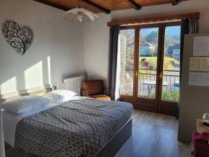 Postel nebo postele na pokoji v ubytování Les Jolis Coeurs