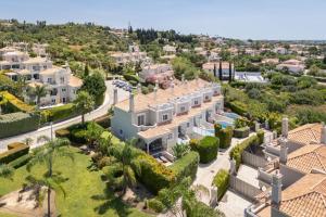 an aerial view of a villa with palm trees at Townhouse Sasha in Almancil