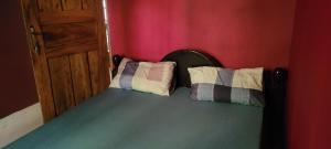 Кровать или кровати в номере Arusha Holiday Safari