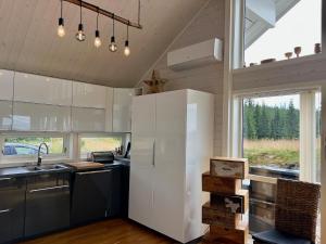 Køkken eller tekøkken på TexasToppen, cabin in Hafjell with sauna