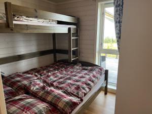 En eller flere senge i et værelse på TexasToppen, cabin in Hafjell with sauna