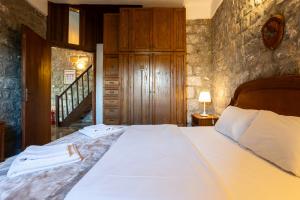 Кровать или кровати в номере Taenarioum antico