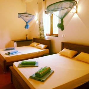 Ένα ή περισσότερα κρεβάτια σε δωμάτιο στο Margosa Guesthouse