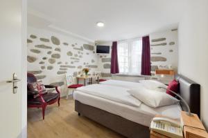 Postel nebo postele na pokoji v ubytování Hotel Hirschen