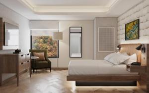 Un pat sau paturi într-o cameră la Hotel Indigo Gatlinburg Downtown by IHG +25 fotografii