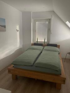 Postel nebo postele na pokoji v ubytování Gemütliches Apartment mit Smart-TV und WLAN in Hamm Mark