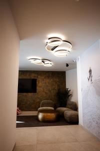 Μια τηλεόραση ή/και κέντρο ψυχαγωγίας στο LH Suites Aparthotel - NEW since 2025