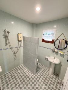 a bathroom with a sink and a shower stall at Sachi Home Villa Bangtao - Near Muay Thai and Beach in Ban Thalat Choeng Thale