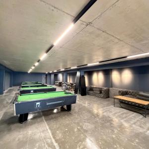 a row of pool tables in a room at EVIS LTD apartments Gudauri in Gudauri