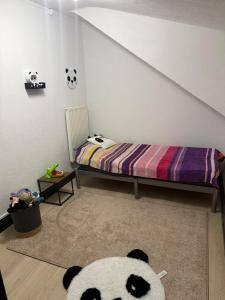 Кровать или кровати в номере Appartement familiale sous les toits