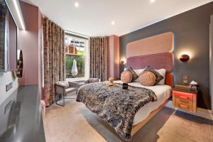 Ένα ή περισσότερα κρεβάτια σε δωμάτιο στο The Cranleigh Boutique