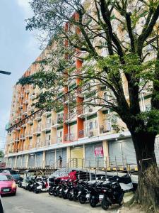 a row of motorcycles parked in front of a building at Naga City River View 2BR UB Apartment in Naga +24 photos