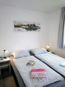 Giường trong phòng chung tại Slechtvalk 17