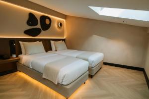 Krevet ili kreveti u jedinici u okviru objekta Hotel Trianon