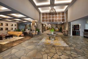 a large living room with a couch and a table at Crowne Plaza Resort Asheville, an IHG Hotel in Asheville