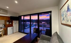 a living room with a view of a balcony at BlueWater Penthouse GuestSuite 2 in Newport