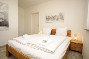 En eller flere senge i et værelse på Villa Kristall