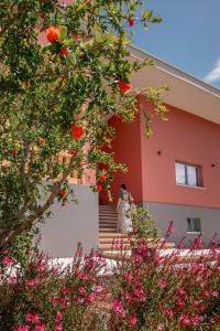 a woman walking up the stairs of a house at Costiero Elegant Suite Gallipoli Mare in Gallipoli +51 photos